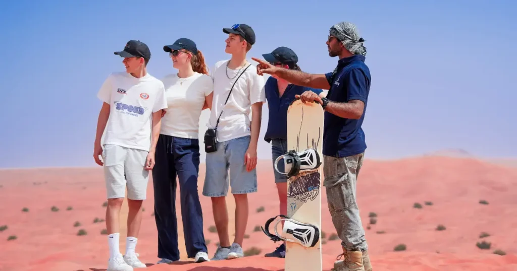 Tourists enjoying dune bashing during a desert safari while avoiding common desert safari mistakes